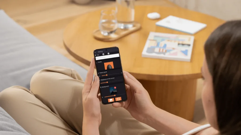 User adjusting flame and background in Candle Light app settings