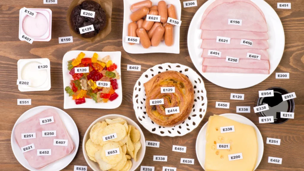 Various processed foods labeled with food additives like E621, E338, E150